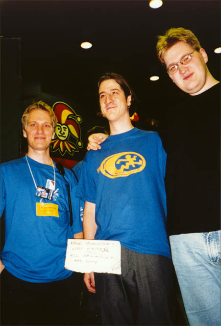 XXX and Hellfire fooling some Assembly-organizer. The sign says "all orgas are gay"